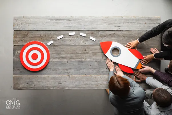 Individuals united in a circle around a target with a rocket, illustrating collective effort towards web development success